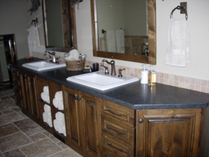 Solid knotty alder ensuite vanity with matching mirror frames.