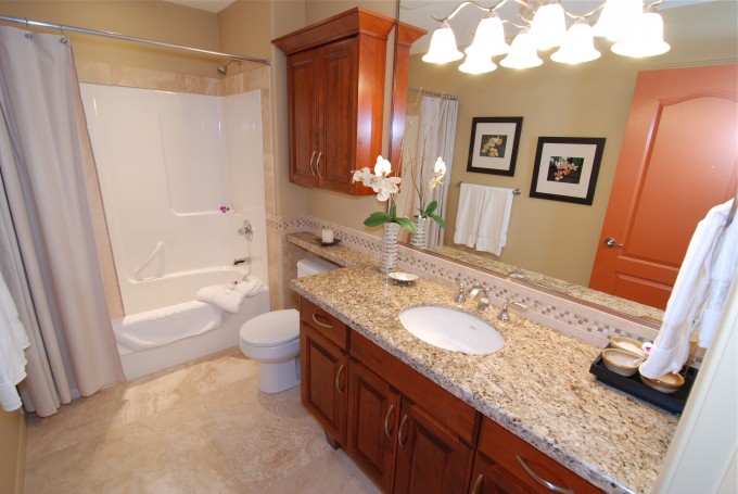 Solid maple raised panel vanity and towel cabinet with granite countertops